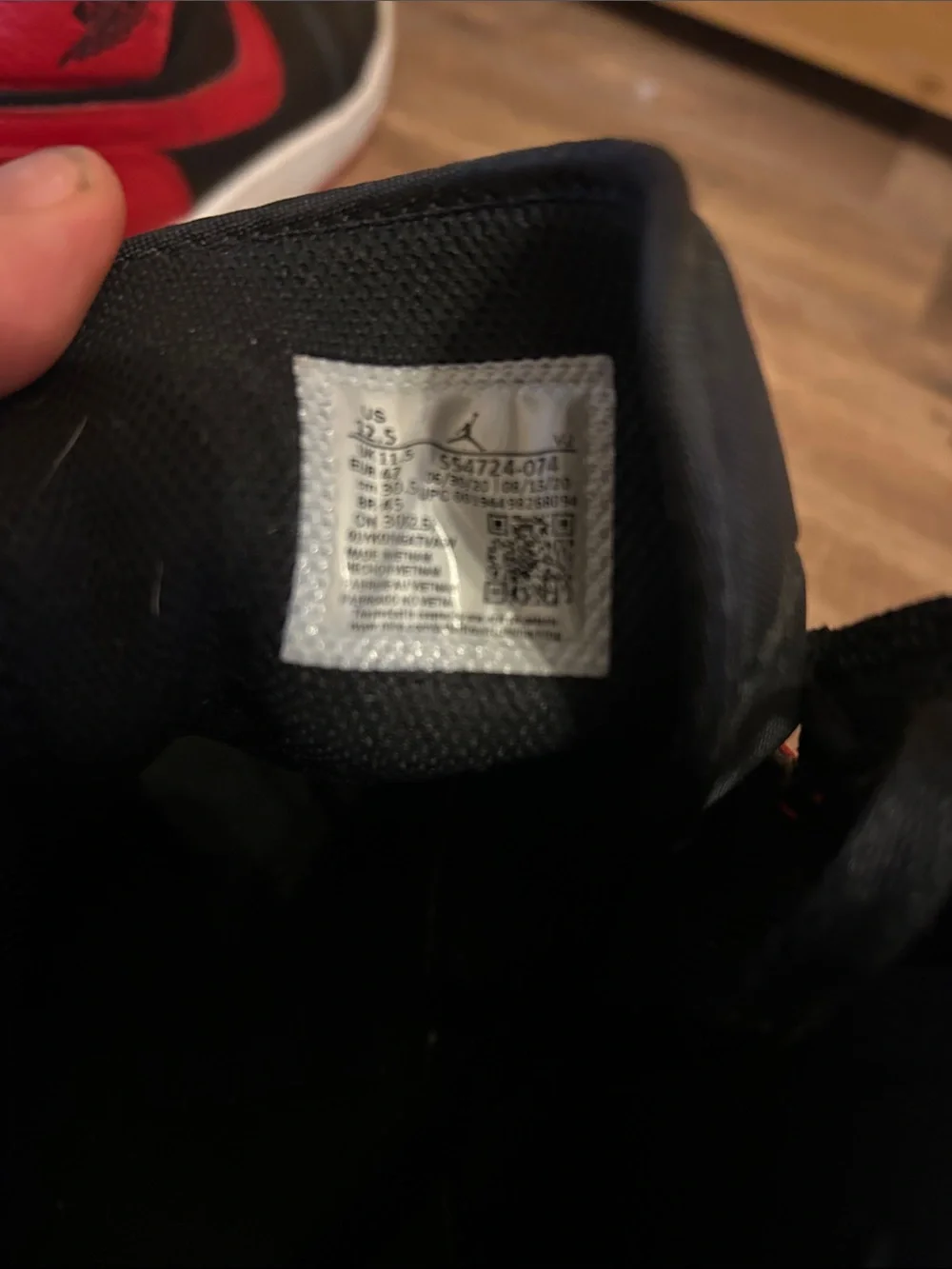 Jordan 1 Retro High Top Sneakers in Black and Red